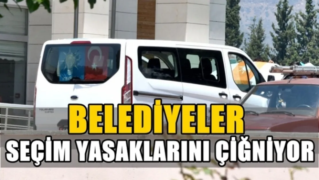 Belediye aracı yasak olmasına rağmen parti bayraklarıyla!...